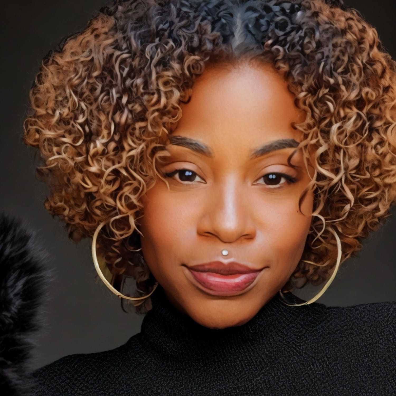 Portrait of Jade Jacobs, a professional stylist at Cole Stevens Salon, showcasing their expertise and style.