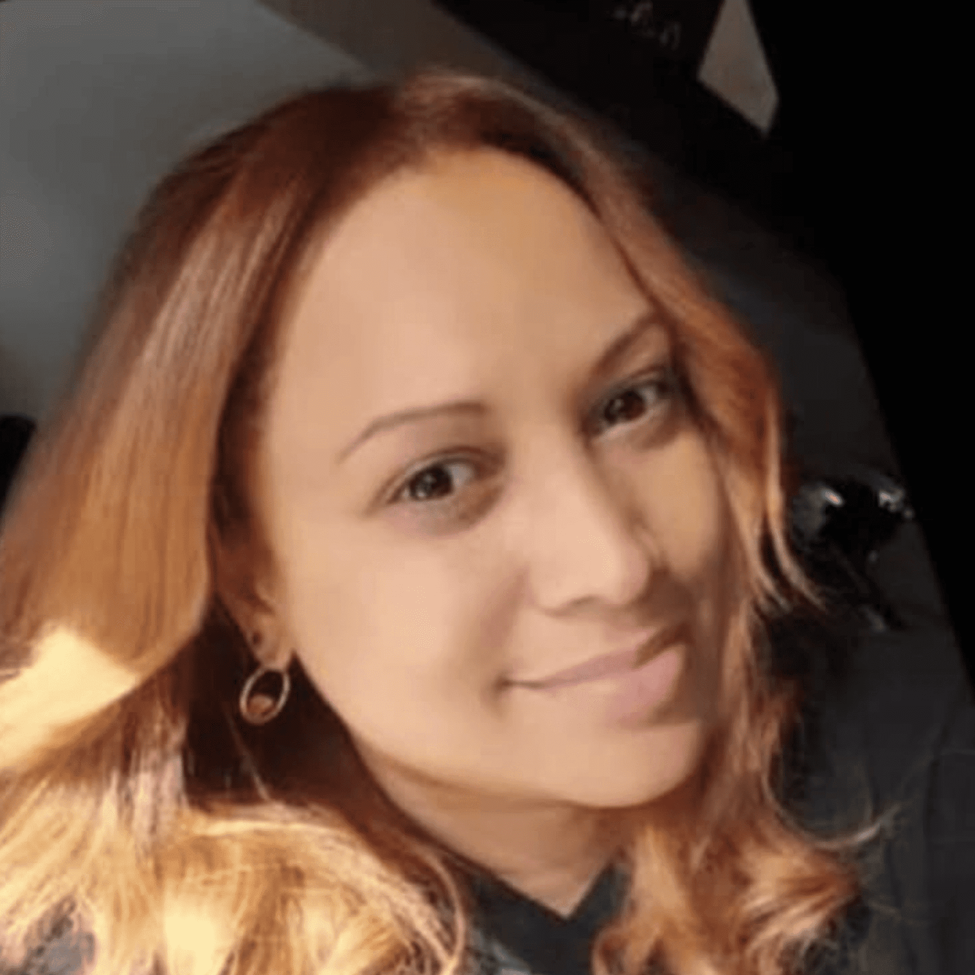 Portrait of Nelly Hernandez, a professional stylist at Cole Stevens Salon, showcasing their expertise and style.