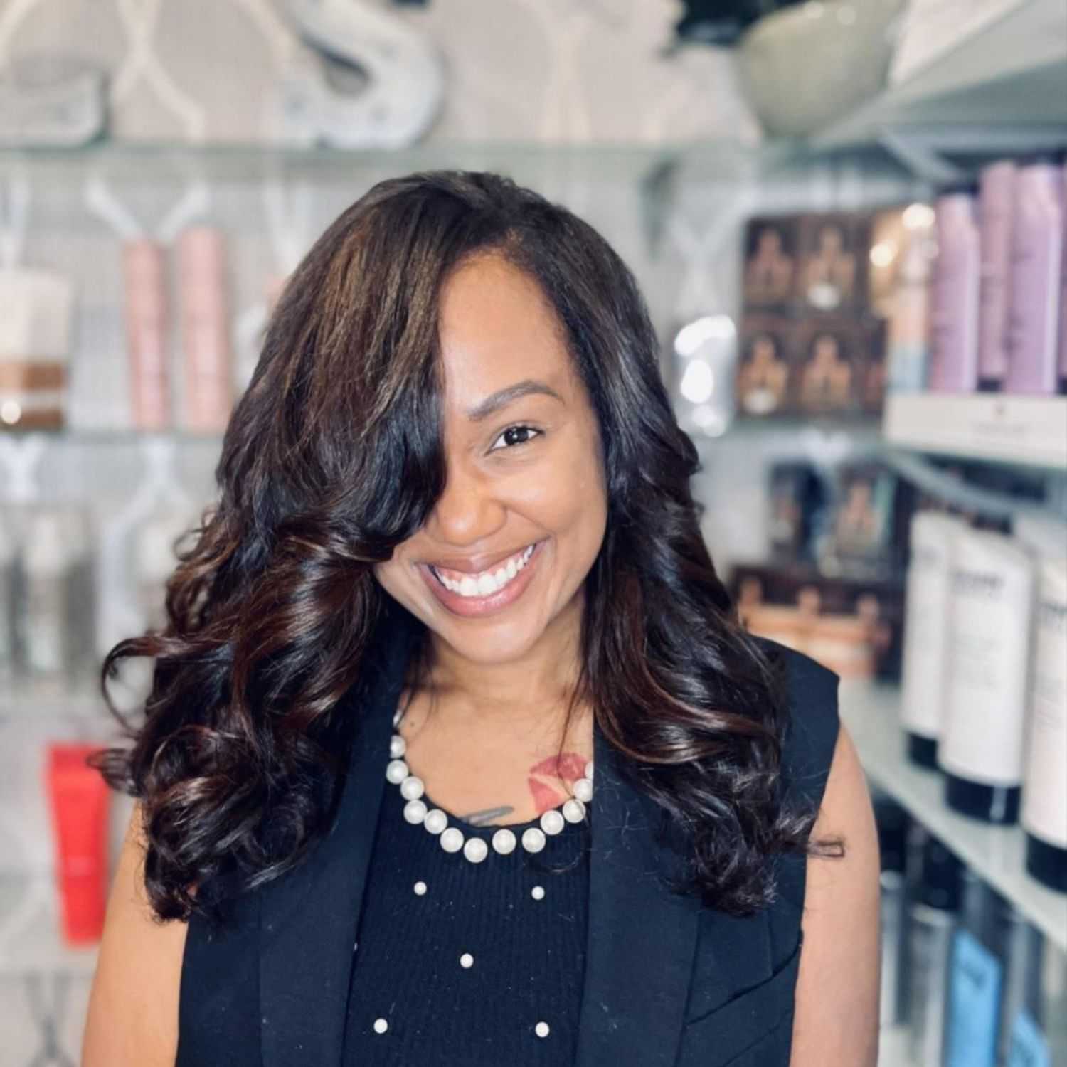 Portrait of Ashley Gibbs, a professional stylist at Cole Stevens Salon, showcasing their expertise and style.